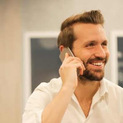 man using smartphone on chair