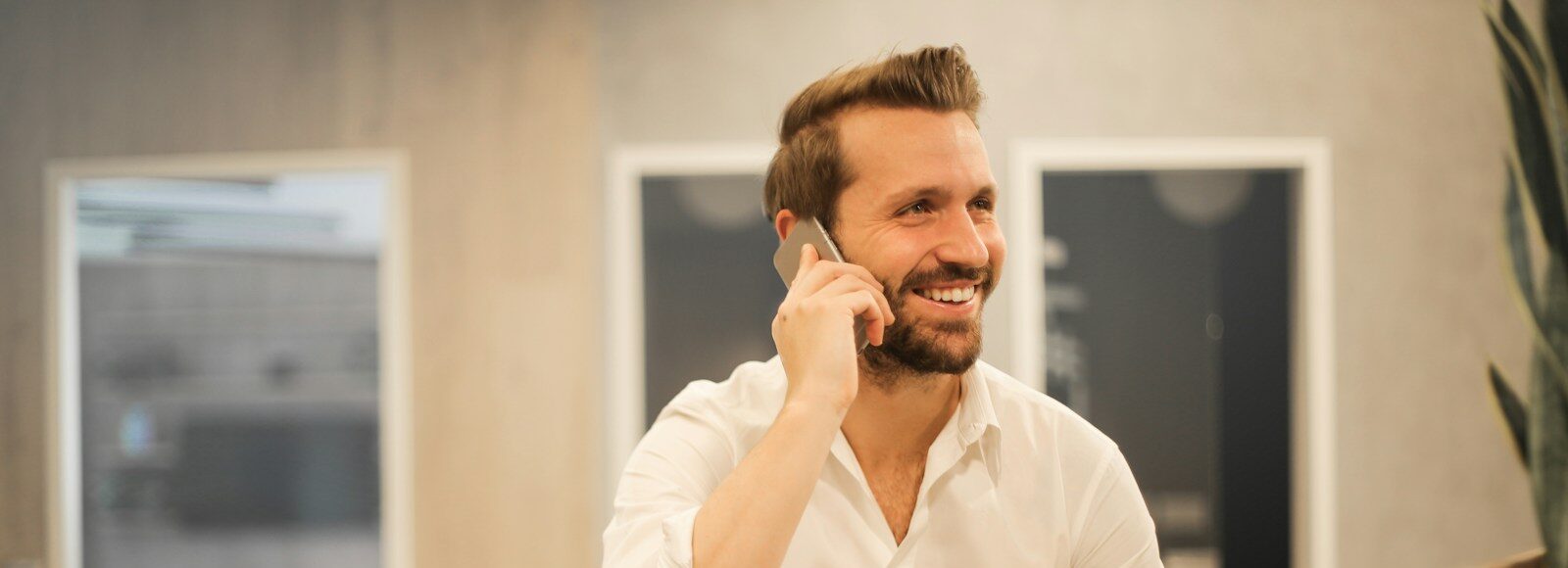 man using smartphone on chair