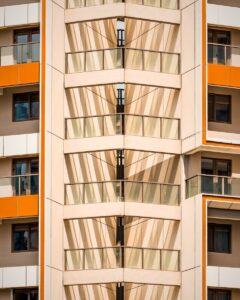 Modern building facade with geometric patterns and balconies