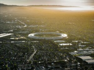 An aerial view of a city with a circular building