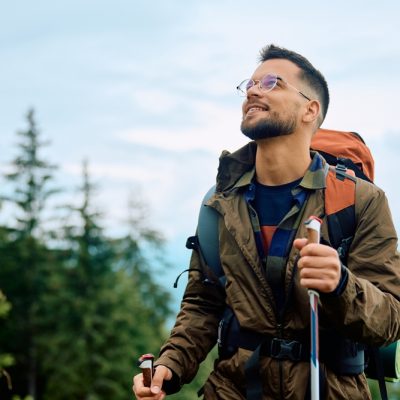 Young,Happy,Man,Hiking,In,The,Mountains.,Copy,Space.